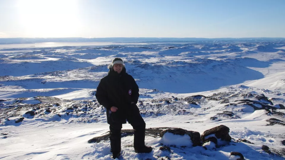 Adrian standing on a snow covered mountain