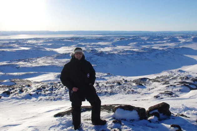 Adrian standing on a snow covered mountain