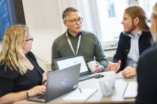 Four people discussing an idea